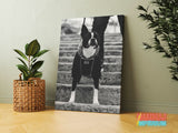 Motivational canvas wall art with a black and white bulldog on stairs leading to a modern office.