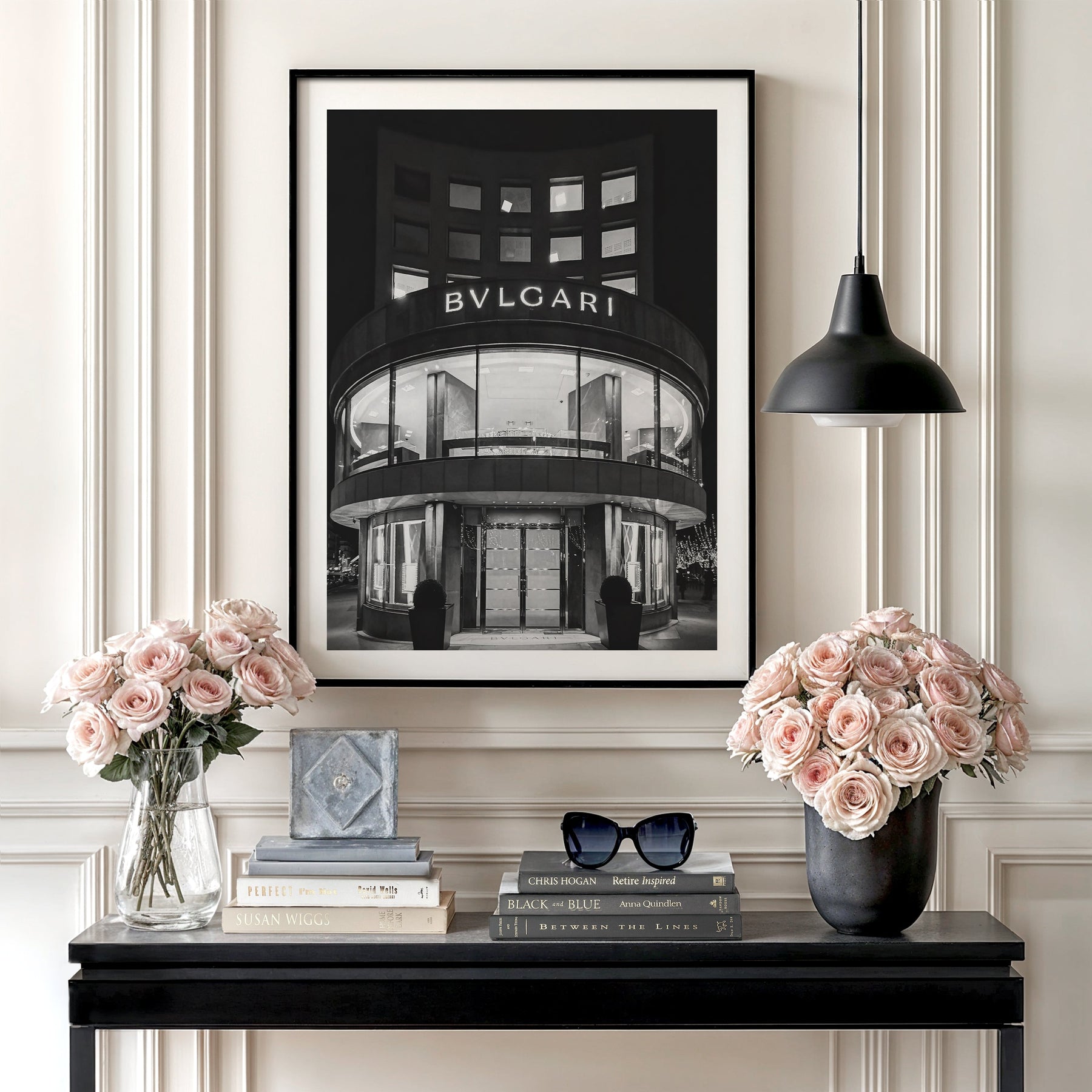 Motivational wall art with a black and white photograph of a BVLGARI store, roses and minimalist interior decor
