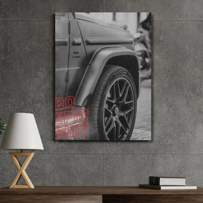 Motivational canvas wall art with a luxury SUV wheel detail and red Do Epic Shit text in a modern office.