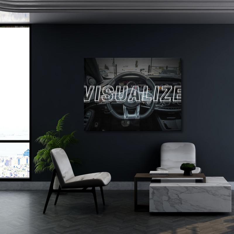 Motivational wall art with a luxury car interior and VISUALIZE text in a modern office.
