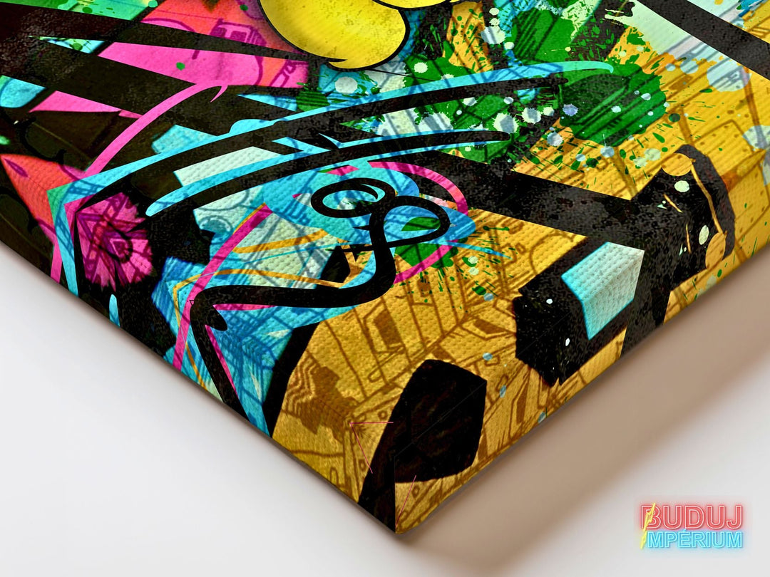 Corner detail of motivational canvas wall art with graffiti texture and colorful spray paint splashes.