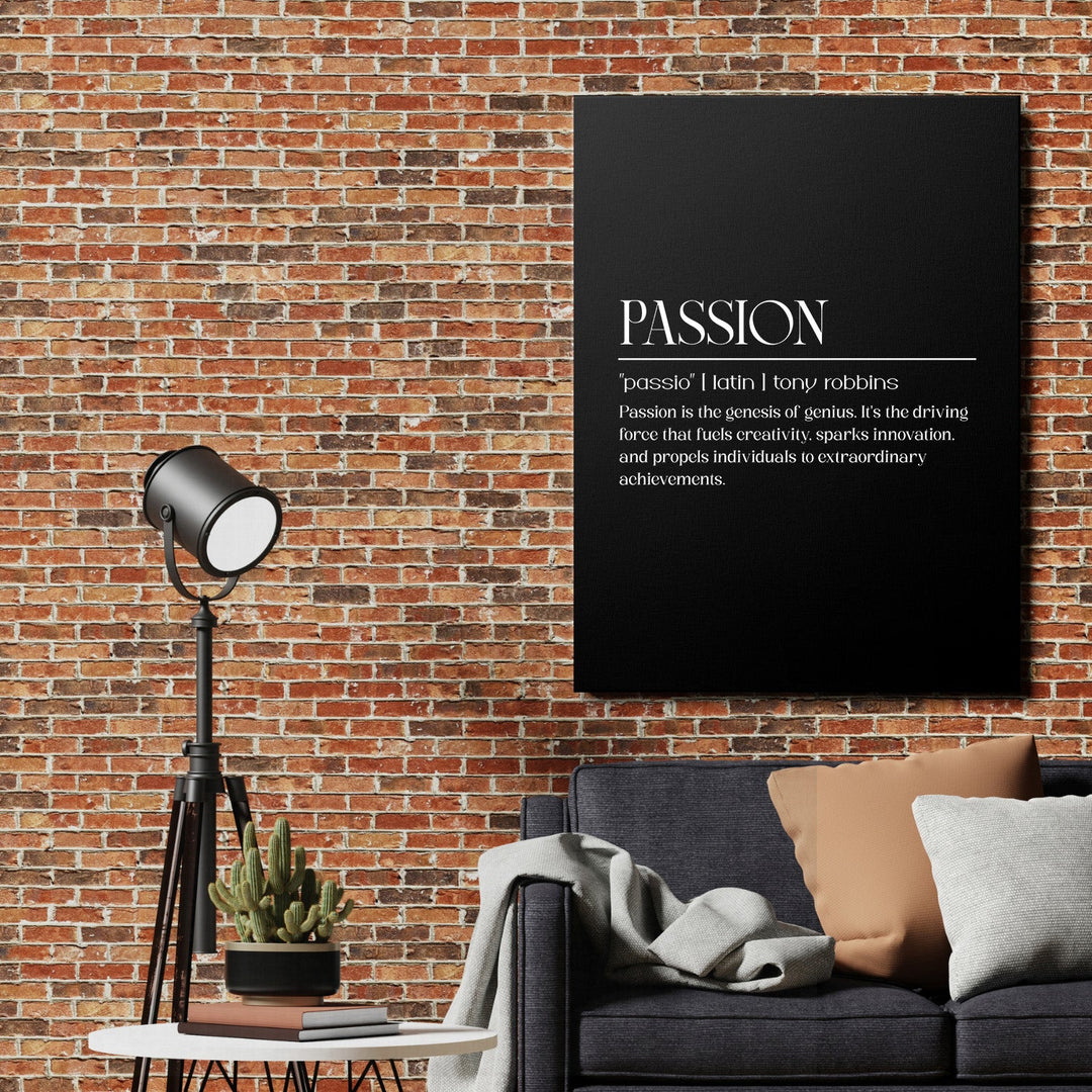 Motivational canvas print with a Tony Robbins quote on a brick wall above a sofa in a modern living room