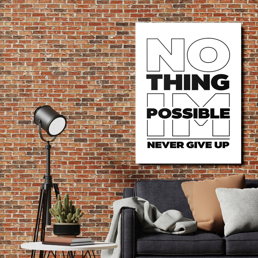 Black and white motivational quote canvas wall art above a sofa on a brick wall in an industrial interior