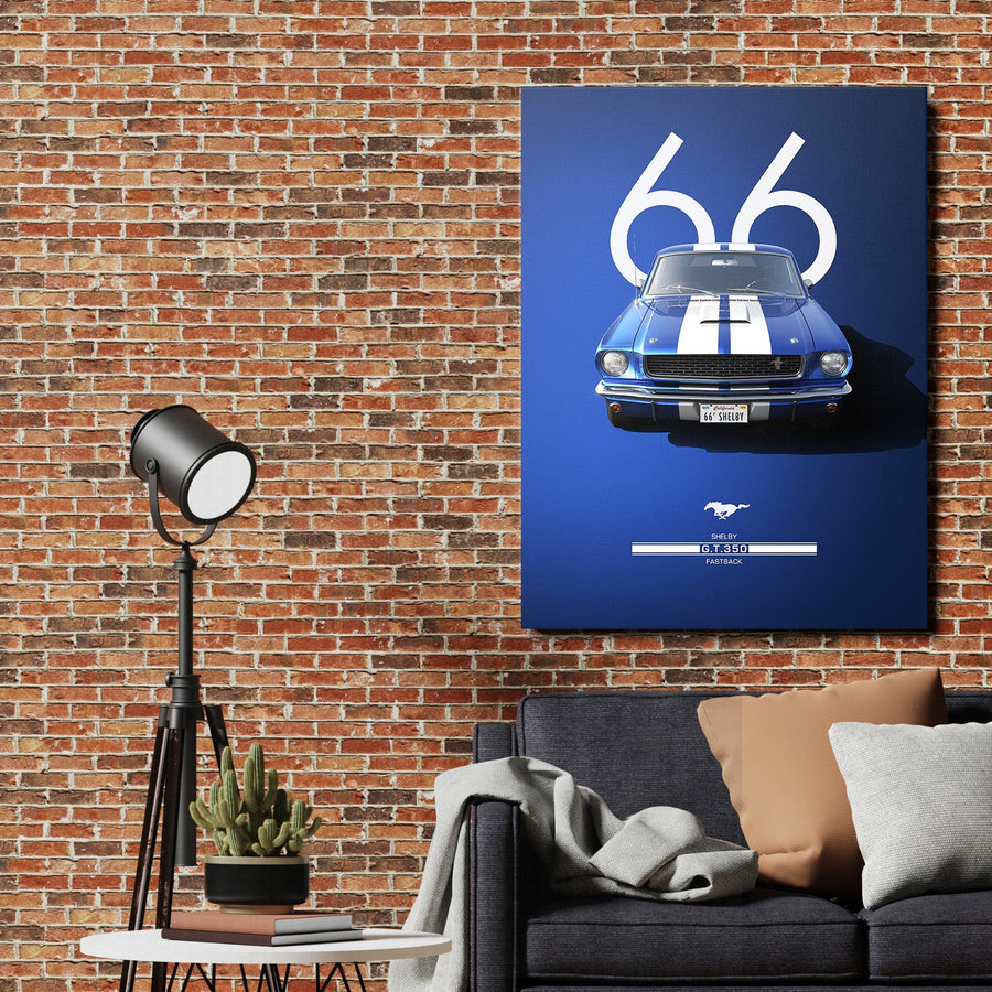 Motivational wall art with a blue Shelby ’66 fastback in front of a brick wall in a living room