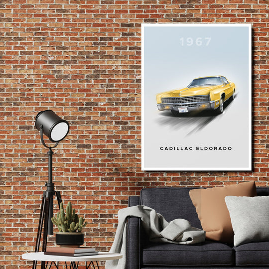 Motivational canvas wall art with a yellow 1967 Cadillac Eldorado above a brick wall in a cozy office