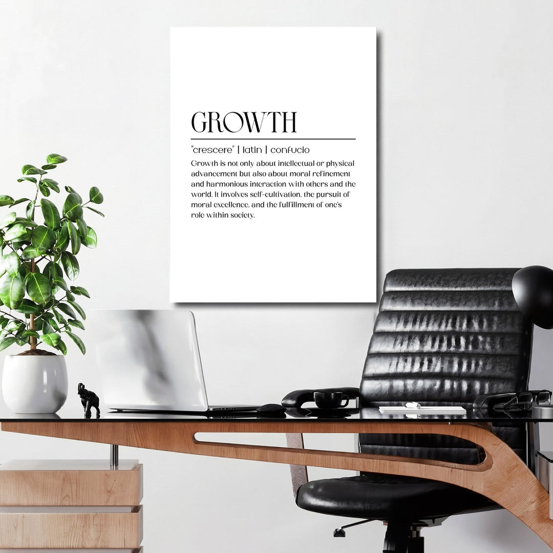 Motivational canvas wall art with the Latin word crescere about growth in a minimalist home office