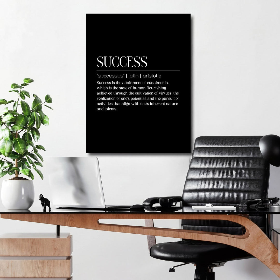 Motivational canvas print with a quote about success by Aristotle above a desk in a modern office