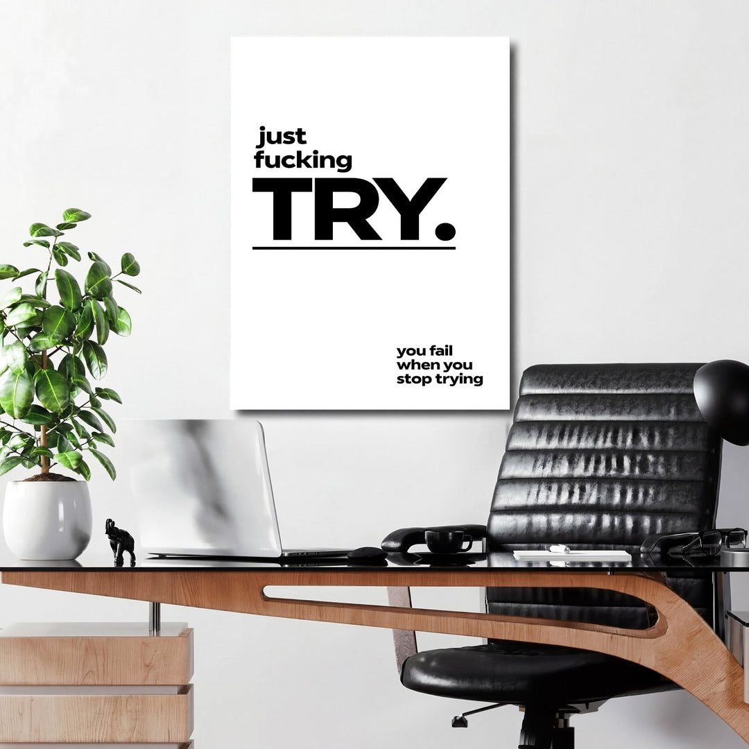 Motivational canvas print with a minimalist black-and-white quote hanging in a modern office