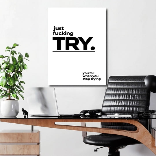 Motivational canvas print with a minimalist black-and-white quote hanging in a modern office