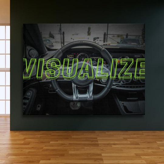 Motivational wall art in a modern office with a luxury AMG steering wheel and green "VISUALIZE" text