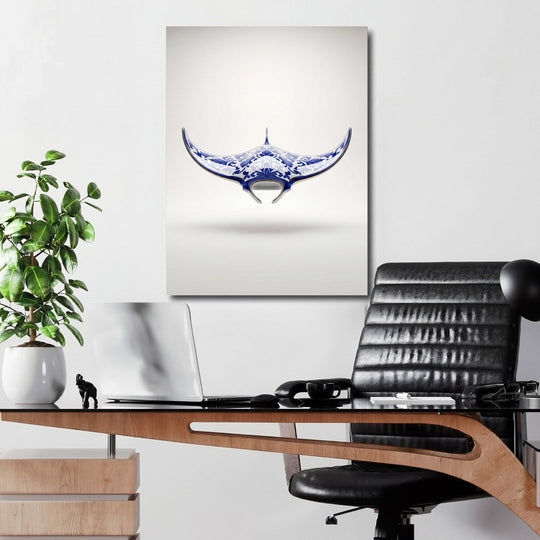 Modern canvas print with a blue-and-white ornamental manta ray hanging on a wall in a home office