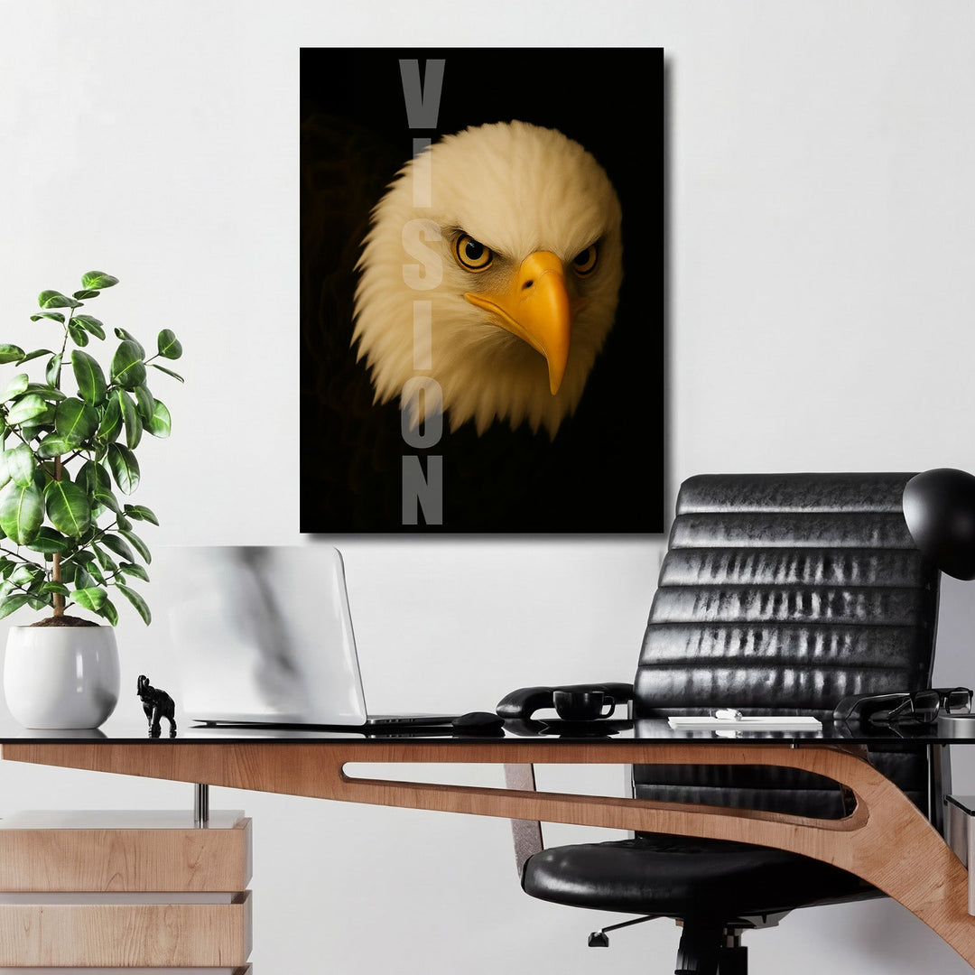 Motivational canvas wall art with a realistic eagle head and VISION text hanging above a desk in an office.