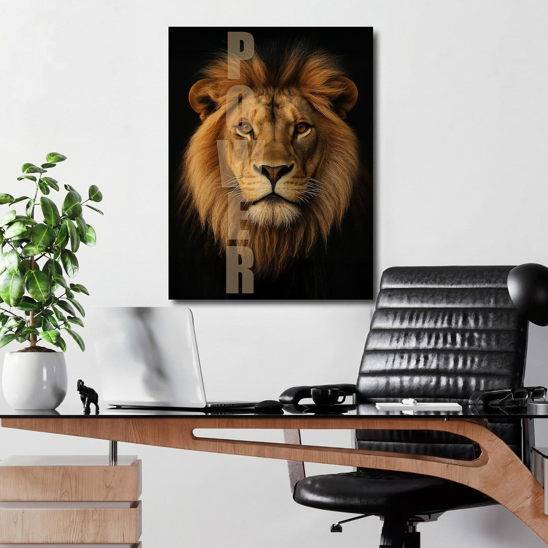 Motivational canvas wall art with a realistic lion and POWER text hanging above a desk in a modern office.