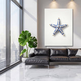 Luxury wall art with a blue-and-white ceramic starfish in a modern living room on a light wall