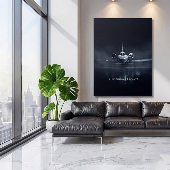 Motivational canvas print with a private jet motif in a minimalist luxury living room