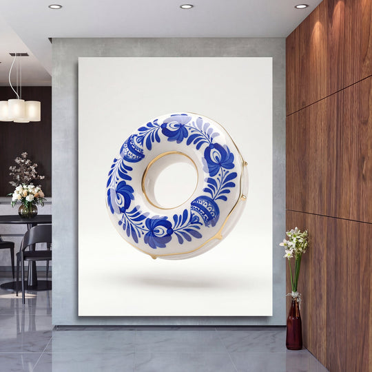 Motivational wall art with a blue-and-white porcelain donut and gold accents in a living room