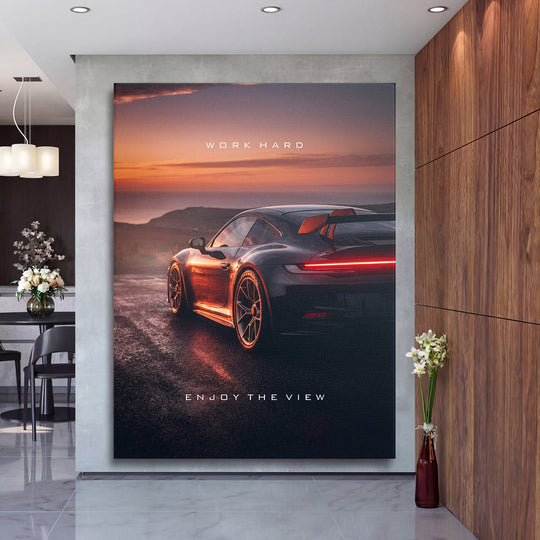 Motivational canvas wall art with luxury sports car at sunset in a modern living room