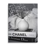 Luxury canvas print with black and white Chanel and Christian Dior book spines