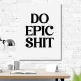 Motivational wall art with black “Do Epic Shit” text in a modern office above a minimalist desk.