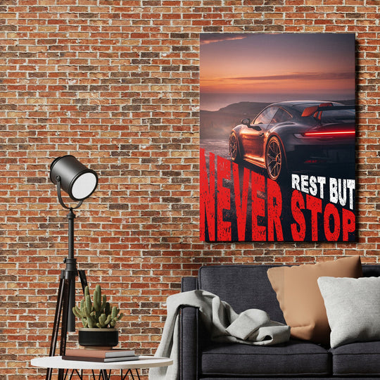 Motivational canvas print: sports car at sunset, “Never Stop” text on a brick wall, lifestyle decor