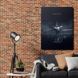 Motivational canvas print with an airplane and the texts “Higher Level” and “Lower Noise” on a brick wall above a sofa