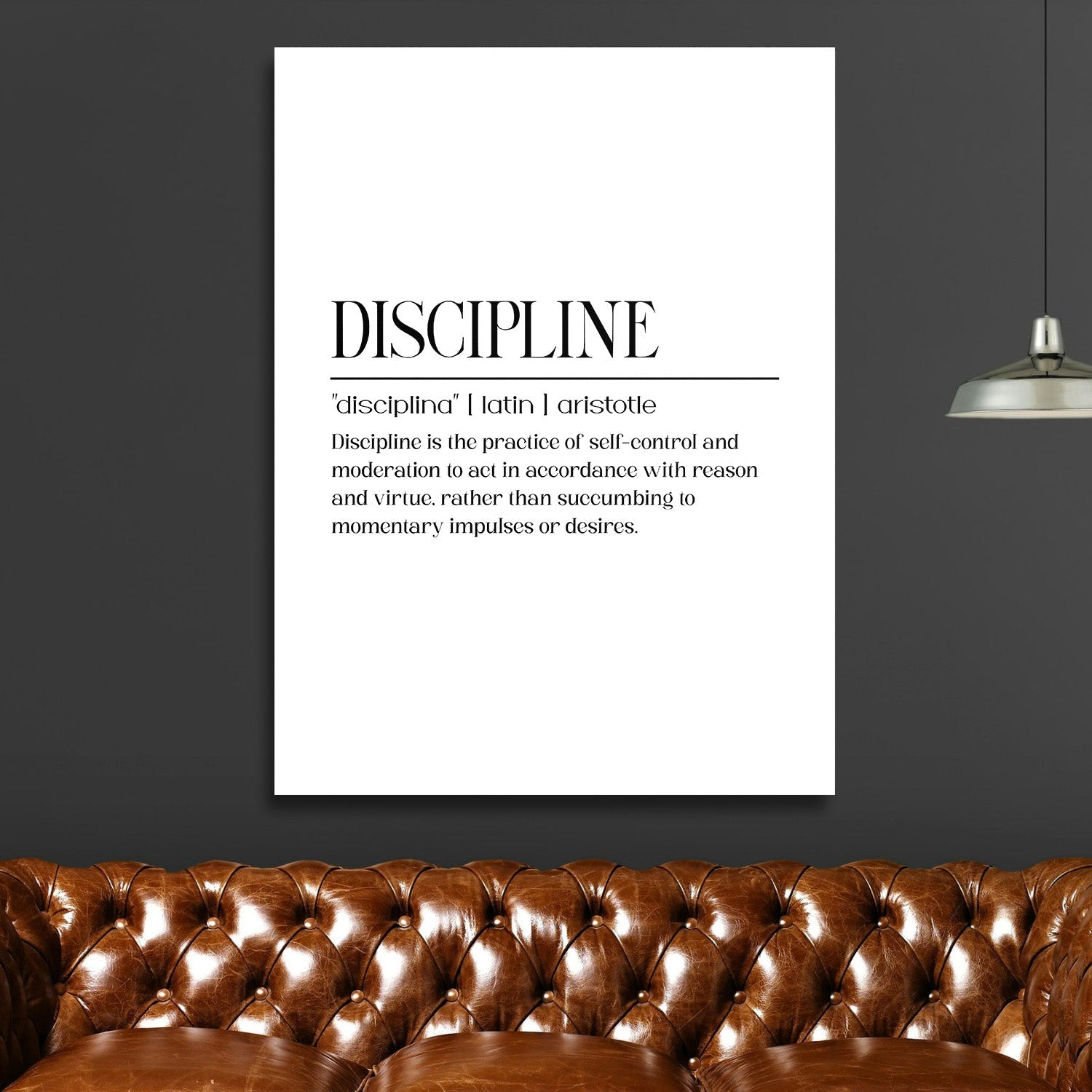 Discipline motivational canvas wall art with a quote in a modern living room above a brown leather sofa