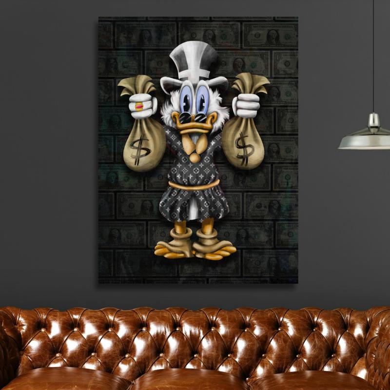 Motivational pop art wall art of Scrooge McDuck with money bags above a leather sofa in a living room.