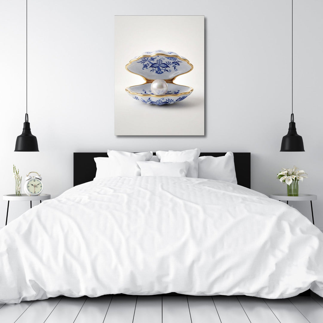 Modern canvas print with a pearl shell above a bed in a white bedroom, minimalist interior