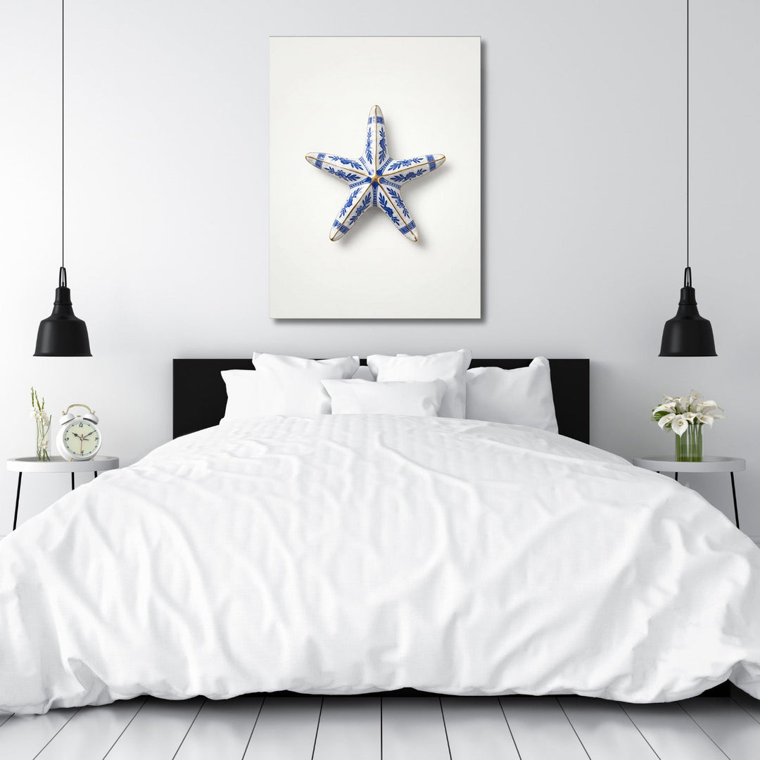 Modern wall art in a bedroom with a blue-and-white ceramic starfish and clean minimalist design