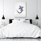 Motivational canvas print with a blue-and-white carp above a bed in a minimalist bedroom