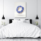 Modern wall art with a porcelain ring and blue flowers in a white minimalist bedroom