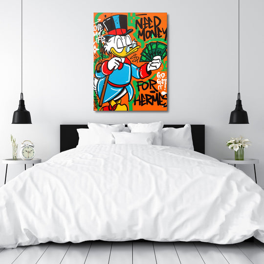 Motivational canvas print with pop art Scrooge McDuck and a money motif hanging above a bed in a bedroom