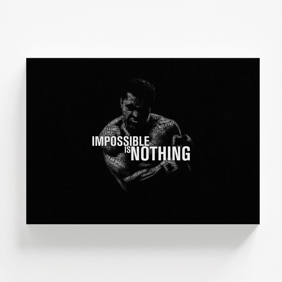 Motivational wall art with a black-and-white silhouette of Muhammad Ali and the bold typography quote “Impossible Is Nothing.”