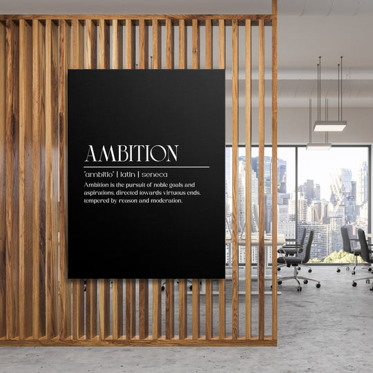 Motivational canvas wall art with an “AMBITION” inscription in a modern office with a wooden screen and city skyline view