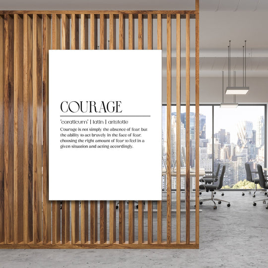 Motivational canvas wall art with a minimalist “Courage” inscription hanging in a modern office