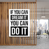 Motivational canvas wall art with a black and white quote in a minimalist modern office