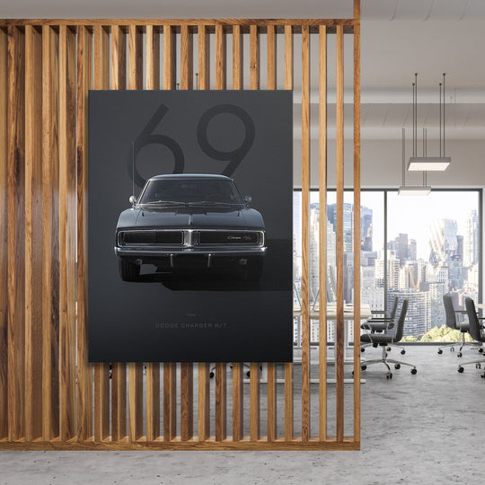 Motivational wall art with a black Dodge Charger front view in a modern office behind wooden slats