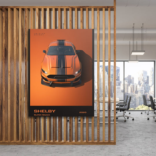 Motivational wall art with an orange Shelby Super Snake sports car in a modern luxury office interior