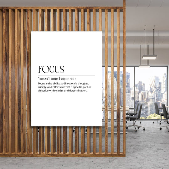 FOCUS motivational wall art with minimalist typography in a modern office behind a wooden grid