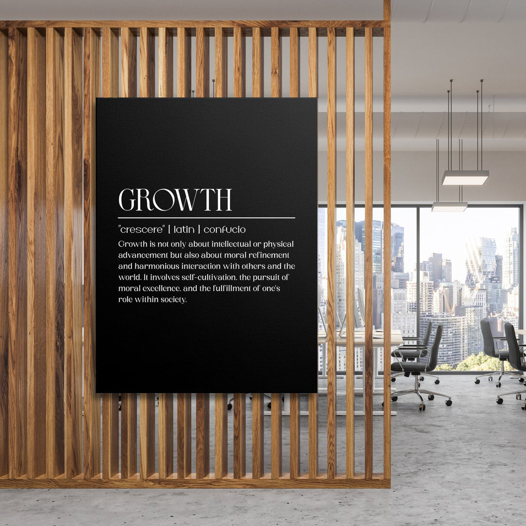 Growth motivational canvas wall art hanging on a wooden partition in a modern office with a city view