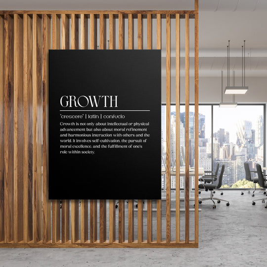 Growth motivational canvas wall art hanging on a wooden partition in a modern office with a city view