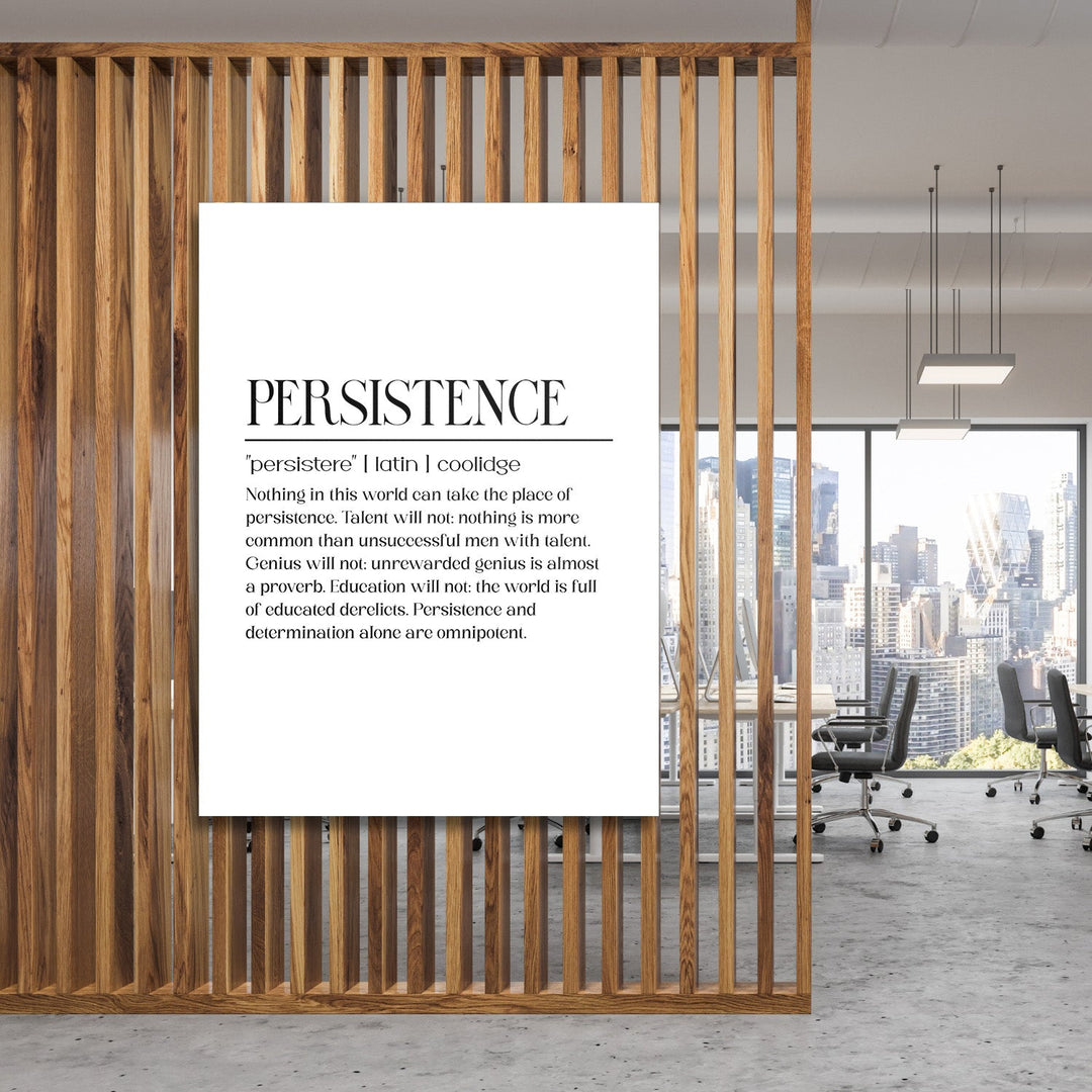 Persistence motivational canvas print with a black-and-white quote in a modern office behind wooden slats