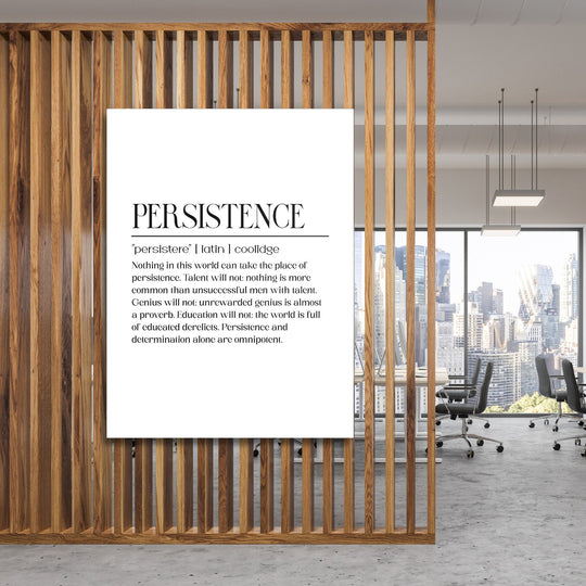 Persistence motivational canvas print with a black-and-white quote in a modern office behind wooden slats
