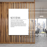 Motivational wall art with a minimalist quote about success in a modern office behind a wooden screen