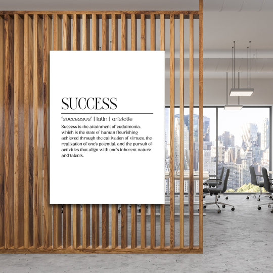 Motivational wall art with a minimalist quote about success in a modern office behind a wooden screen