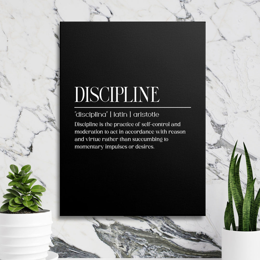 Motivational canvas print with Aristotle’s discipline quote hanging on a marble wall between green plants