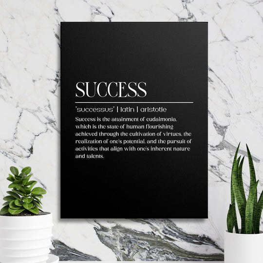 Motivational canvas print with a white Aristotle quote on a black background, marble wall and green plants