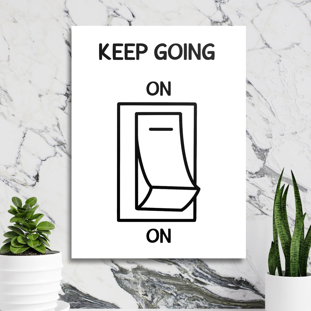 Motivational wall art with a black and white calendar graphic in a minimalist lifestyle arrangement on a marble wall