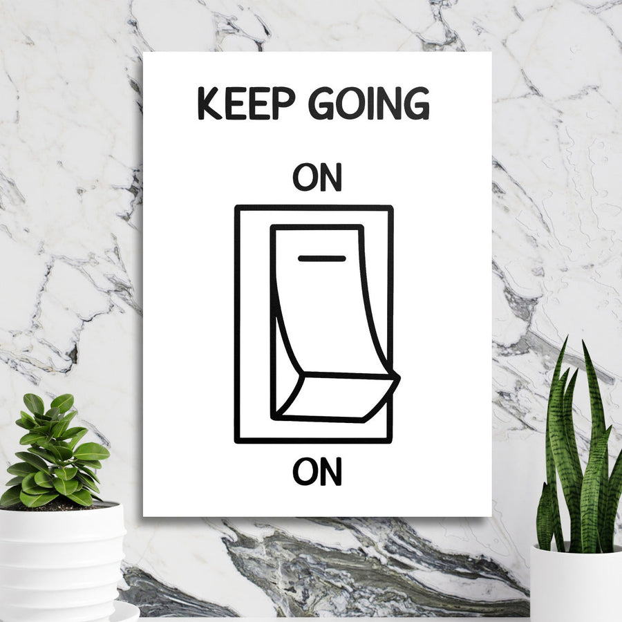 Motivational wall art with a black and white calendar graphic in a minimalist lifestyle arrangement on a marble wall