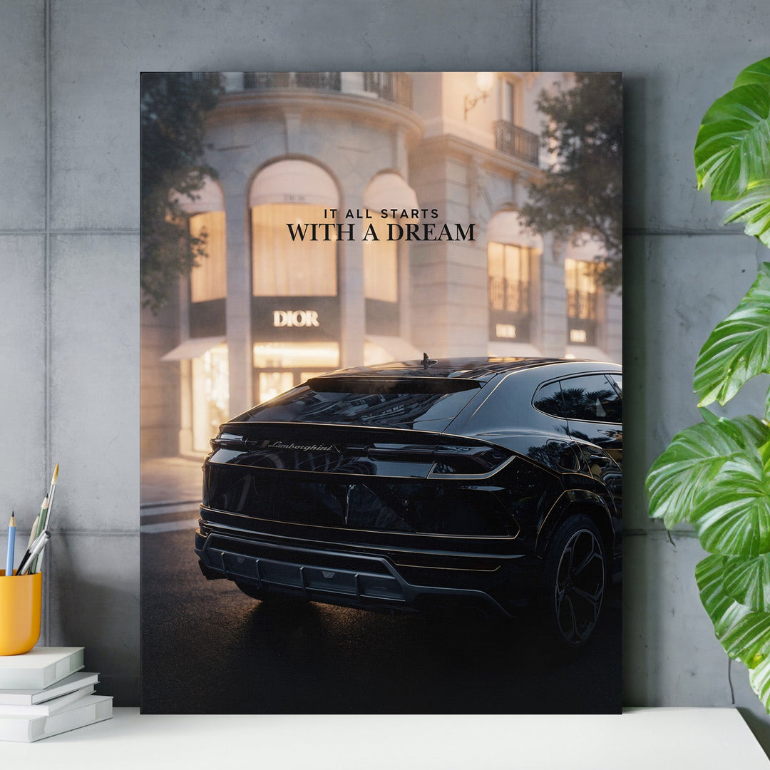 Luxury wall art with a black Lamborghini in front of a Dior boutique and the text “It All Starts With a Dream”